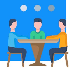 Drie personen zitten om de tafel