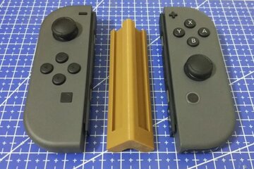 Beeld van: Nintendo Switch spelcomputer met twee controllers